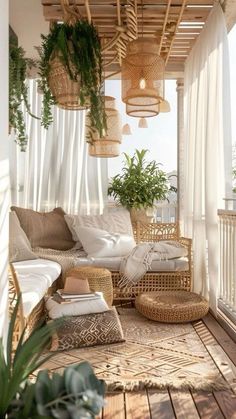 a porch with wicker furniture and hanging plants