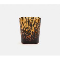 an animal print glass is shown against a white background