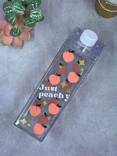 a clear water bottle with oranges and stars on it