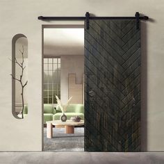 a living room with a green couch and sliding door that opens to the dining area