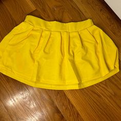 Never Worn Casual Yellow Mini Skirt For Party, Amazon Casual Fitted Skirt, Casual Yellow Stretch Skort, Casual Fitted Skirt By Amazon, Casual Yellow Flared Mini Skirt, Yellow Pleated Casual Skort, Casual Yellow Pleated Skort, Yellow Stretch Skort For Spring, Casual Yellow Pleated Mini Skirt