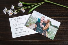 two wedding photos are laying next to each other on a wooden table with daisies