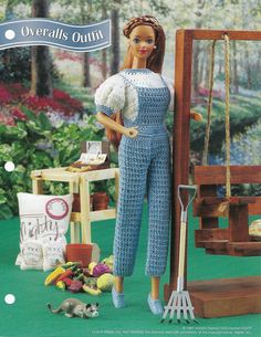 a doll is posed next to a miniature swing set