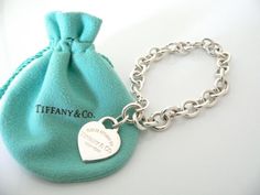 Overview:Offered for sale is a wonderful and mint Tiffany and Co.  Sterling Silver "Return to Tiffany" Heart Tag bracelet - in a rare and hard to find longer length - 8.5 Inches.   The piece is  made from substantial and bright Tiffany silver, and yet retains a very  feminine feel to it.   It is a classic Tiffany piece that will most  certainly be a piece that you will be used over and over again, so it is  great value for the money!  It is a wonderful piece that fits a  lifestyle on the go -- t Tiffany Like Shade Black And Whote, Large Family Love Tiffany, Please Return To Tiffany And Co, Elegant Bracelet Tiffany & Co., Bracelets Tiffany & Co., Tiffany And Co Bracelet Sterling Silver, Pink Tiffany And Co Charms, Tiffany Charm Bracelet Tiffany & Co., Tiffany & Co. Bracelet