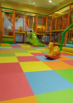 children's play area with colorful tiles and slides