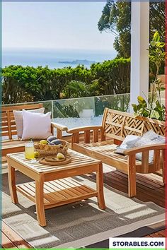 a wooden bench sitting on top of a patio next to a table with fruit and drinks