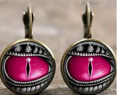 This Dragon Eye Earring set is truly piercing! The vivid Hot Pink and its vivid, vivacious hue captivate immediately. Take notice of this pretty antique looking set that is eye-catching! These come in many other fun colors too so add to your collection or be sure to at least take a further peek! Fashion jewelry is made of alloy type material Artistic Pink Jewelry For Party, Artistic Pink Party Jewelry, Vintage Pink Metal Earrings, Retro Adjustable Pink Earrings, Artistic Pink Nickel-free Earrings, Retro Pink Nickel-free Jewelry, Hot Pink Fashion, Eye Piercing, Personality Gifts