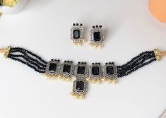 This choker comes with a set of earrings. The color is a beautiful deep black and can be paired with any outfit. Formal Black Bead Choker Jewelry, Elegant Black Jewelry Set For Wedding, Black Wedding Choker Jewelry, Formal Black Beaded Choker Jewelry, Elegant Black Bridal Necklace For Formal Occasions, Formal Black Beaded Choker, Black Jewelry Sets For Party, Elegant Black Jewelry Sets For Festive Occasions, Elegant Black Choker For Wedding