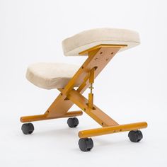 a wooden chair with wheels and a cushion on it