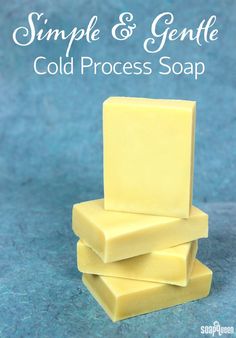 three pieces of yellow soap stacked on top of each other in front of a blue background