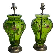 two green vases sitting next to each other