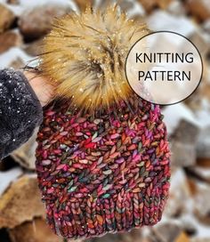 a knitted hat with a pom - pom attached to the top and text overlay that reads knitting pattern