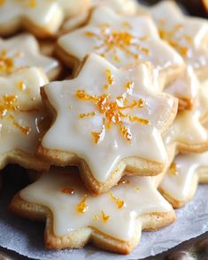 a plate full of cookies with orange zest on them