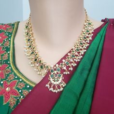 "Handmade Indian Temple Jewelry, best to wear it for traditional ceremonies or Indian wedding. This bridal jewelry has ethnic finish. It has Cubic Zircon stones with ruby and emeralds. It is a Bollywood style one gram jewelry. There are long and short patterns of Indian jewelry in Kundan, Pearls, CZ, American Diamond , ruby, emerald, Polki, kemp to suit every occasion of South Indian and North Indian weddings. Handmade Indian Jewelry item * Stunning Hand made Gold Plated jewelry set. * Necklace Green Stone Work Bridal Necklace, Traditional Drape Wedding Jewelry With Latkans, Kundan Necklaces For Traditional Ceremonies, Traditional Jewelry With Intricate Design For Ceremonies, Traditional Jewelry For Ceremonies With Intricate Design, Chandbali Jewelry With Stone Work For Traditional Ceremonies, Bohemian Kundan Temple Necklace For Wedding, Bohemian Stone Work Jewelry Sets For Wedding, Traditional Festive Jewelry With Stone Work