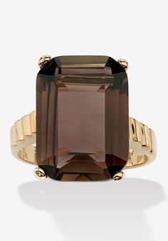 A ring of elegance with its classic design and exquisite color, this emerald-cut smoky quartz features a unique step-cut setting for added dimension. Gold-plated. It's truly a statement of fashion and sophistication. Richly plated in 14k yellow gold. Sizes 5-10.Main Stone: 1 Emerald Faceted Cut Genuine Smoky Quartz, 10.75 carats, 18 mm x 13 mm14k Gold-PlatedDimensions: 20 mm wide x 17 mm long x 9 mm highIncludes gift box and drawstring pouch available in sizes 5-10 | Women's Yellow Gold-Plated G Faceted Ring, Smoky Quartz Ring, Brown Stone, Top Rings, Quartz Jewelry, Gold Plated Rings, Quartz Ring, Smokey Quartz, Gold Diamond Rings