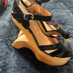 Never Worn. Size 7. Designer Black Heels With Wooden Heel, Elegant Black Sandals With Wooden Heel, Black Wedge Heels With Wooden Heel, Black Sandals With Stacked Heel And Almond Toe, Designer Black Wedge Heels, Black Almond Toe Sandals With Stacked Heel, Formal Black Heels With Wooden Heel, Black Closed Toe Heels With Wooden Heel, Funky Heels