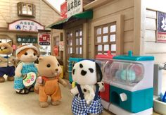 several stuffed animals are standing in front of a toy store