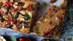 two slices of fruit bread sitting on top of a cutting board