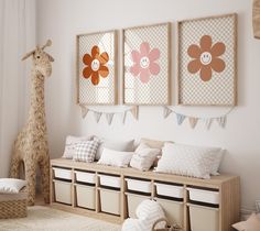 a child's room decorated in neutrals and whites with giraffe wall art