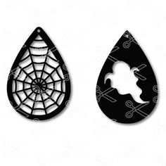 two black and white tear shaped paper cut outs with spider webs on the side