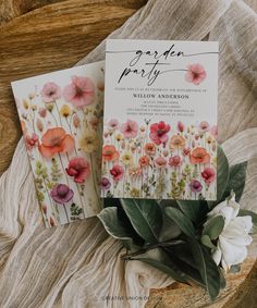 two wedding cards with flowers on them