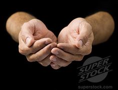 two hands folded in the shape of a heart on black background with superstock logo