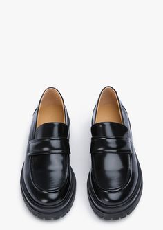 Stand-out from the crowd with our Wiz loafer. Showcasing a shiny black leather exterior, this design features an exaggerated chunky sole with a sleek rounded toe-shape, a high-cut vamp and is finished with a leather upper, lining and cushioned foot-bed. -Material: Leather Upper & Lining -Sole: Man-Made -Fit: We recommend choosing a half size down -Toe-shape: Rounded -Features: Chunky sole -Heel: 4.5cm Classic Black Platform Loafers With Contrast Sole, Modern Black Platform Loafers With Lug Sole, Modern Formal Platform Loafers With Contrast Sole, Modern Business Platform Loafers With Contrast Sole, Classic Black Platform Loafers With Lug Sole, Modern Black Platform Loafers With Chunky Sole, Formal Platform Loafers With Contrast Sole And Round Toe, Modern Black Platform Loafers With Chunky Platform, Modern Black Platform Loafers For Work