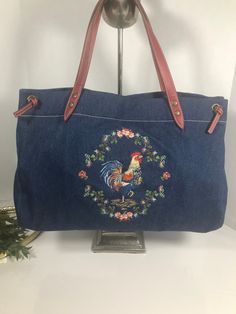 Vintage denim purse handbag tote, Vintage denim embroidered tote bag purse, Vintage blue denim rooster Cappelli bag, Vintage Cappelli tote. Measurements: Height 10" Width 15" Depth 5.5" Straps 15.5" Vintage Denim Tote Shoulder Bag, Embroidered Denim Bags For Everyday Use, Spring Denim Tote Shoulder Bag, Casual Embroidered Denim Bag, Blue Embroidered Denim Bags, Embroidered Canvas Shoulder Bag For Shopping, Casual Embroidered Canvas Shoulder Bag, Blue Embroidered Canvas Bags, Vintage Blue Embroidered Bag