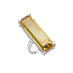 Add an extra touch of sophistication to your ensemble with our Lucille Rectangle Ring. This ring is a masterful blend of modern design and timeless elegance, designed to draw attention and create an alluring focal point on your hand. The long rectangular centerpiece is a unique element that gracefully elongates your fingers and adds a touch of contemporary style. View this post on Instagram A post shared by 𝔹𝕠𝕦𝕟𝕜𝕚𝕥 𝕁𝕖𝕨𝕖𝕝𝕣𝕪 (@bounkitnyc) Modern White Gold Ring With Rectangular Stone, Modern White Gold Rings With Rectangular Stone, Elegant Rectangular Jewelry For Evening, Modern Silver Ring With Rectangular Stone, Modern Topaz Ring With Rectangular Stone For Formal Occasions, Modern Formal Topaz Ring With Rectangular Stone, Modern Silver Rings With Rectangular Stone, Modern Gemstone Party Rings, Elegant Polished Topaz Open Ring