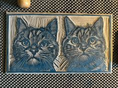 there are two cats on this tile