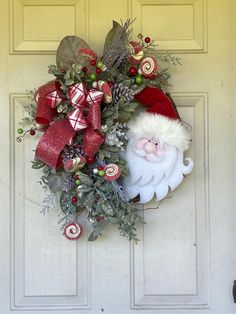 a christmas wreath with santa clause and candy canes