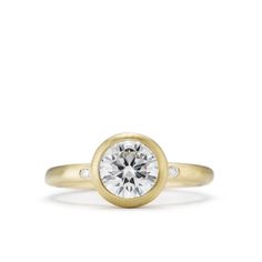 Cairo ring features a soft brushed finish and a low base bezel style head, accented with flush set round diamonds in the shank. The buttery finish of the yellow gold will go well with any color of diamond; made for a 1 carat round diamond center, or custom order around a cushion or oval shaped diamond. This ring is available in rose, white and yellow gold. Please contact us to review your options. 1 Carat, Cairo, 18k Rose Gold, Round Diamond, Colored Diamonds, Round Diamonds, Bracelet Watch, Diamonds, White Gold