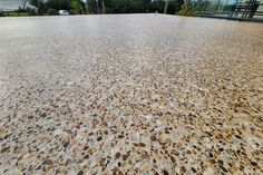 an image of a concrete surface that looks like it is made out of pebbles