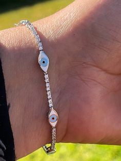 Gorgeous Classy Glamorous Evil Eye Tennis Bracelet Sterling Silver 92.5 Tennis Bracelet  With cubic zirconia stones . Bracelet measures from 6-7.2 inches  Adjustable bracelet with lobster clasp Add extra protection to your daily outfits with this precious evil eye 🧿 bracelet 🥰 Evil eye jewelry is well known for good luck and protection. Elegant Silver Evil Eye Bracelet, Adjustable Silver Evil Eye Bracelet Gift, Silver Bohemian Evil Eye Bracelet Gift, Adjustable Silver Bohemian Evil Eye Bracelet, Evil Eye Tennis Bracelet, Adjustable Sterling Silver Evil Eye Bracelet, Spiritual Style, Protection Bracelet, Evil Eye Bracelet, Tennis Bracelet