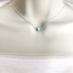 "A tiny larimar bead suspended on a delicate chain, it is a great everyday go-to necklace, available in sterling silver, gold filled or rose gold. ♥ 5mm Larimar bead, greenish blue with white clouds ♥ Larimar is found in Dominican Republic. It represents peace and clarity, healing and love ♥ 3rd picture is the guideline for necklace length, please be sure to select the correct length for your need ♥ If you don't see the length you want in the drop down box, please leave me a message in the \"Not Blue Gemstone Necklace, Larimar Necklace, Larimar Jewelry, Greenish Blue, Necklace Simple, White Clouds, Jewelry Sterling Silver, Delicate Chain, Choker Necklaces