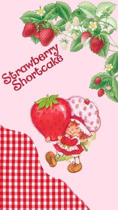 the strawberry shortcake is in front of some strawberries on a checkered table cloth