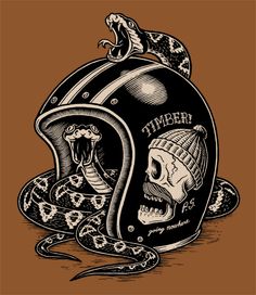 a motorcycle helmet with a snake on the side and a skull in the middle, sitting next to it