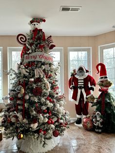 a christmas tree with santa claus and other decorations