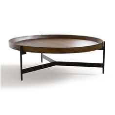 an oval coffee table with metal legs and a wooden tray on the bottom that is shaped like a cross