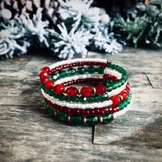 Beautiful holiday memory wire bracelet is perfect for this season. It is for all of you Christmas lovers, this beauty is made with festive red and green Czech glass and Japanese seed beads. Memory wire bracelets will fit any wrist size and wont lose its shape, which makes it a Perfect gift for a loved one! #etsyshop #beadedbracelets #wishlist #christmasjewelry #holidayjewelry #bohemianjewelry Memory Wire Christmas Bracelets, Adjustable Festive Bracelets With Faceted Beads, Festive Bracelets With Faceted Beads, Adjustable Faceted Beads Bracelets For Festive Occasion, Bohemian Round Bead Bracelets For Holiday, Bohemian Festive Bracelets With Faceted Beads, Bohemian Beaded Bracelets With Round Beads For Holiday, Festive Stackable Beaded Bangle Bracelets, Festive Adjustable Stackable Bracelets