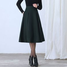 "More color: https://etsy.me/3NgO20M ★★ FEATURES * Wool skirt * Polyester lining * Two side seam pockets * Right zipper closure * pleated detail * Plus size full skirt * A Line Skirt * Perfect for Winter, autumn, spring * Dry clean ★★ The model is 170 cm (5′ 7″) tall with a 80 cm (31.5\") bust, 66 cm (26\") waist. She is wearing the green wool skirt in size XS. ★★ Bespoke Order Service If you Request other color Request the length Your height is not between 155 cm- 172 cm Your weight is over 75 Chic A-line Winter Skirt, Elegant Full Pleated Skirt In Solid Color, Elegant Solid Pleated Skirt For Winter, Solid Color Full Pleated Skirt For Work, Winter Knee-length Lined Pleated Skirt, Solid Color Full Skirt For Office, Office Full Skirt In Solid Color, Elegant Wool Pleated Skirt With Lining, Winter Solid Pleated Skirt