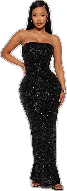 a woman wearing a black dress with sequins