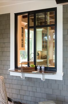 an open window on the side of a house