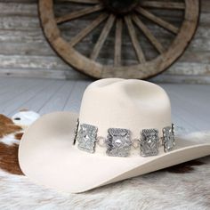 Add a bold, western touch to your hat with our Large Rectangle Concho Hat Band. Featuring silver-tone conchos measuring 1.75 inches high by 1.5 inches wide, this band fits most adult hat sizes and is adjustable for a perfect fit. Hat not included.     Color: Silver  Concho Dimensions: 1.75 inches high x 1.5 inches wide  Fits Most Adult Hat Sizes  Adjustable  *Hat not included*  CA Residents: Prop 65 Warning ↗️ Southwestern Concho Hat For Rodeo, Southwestern Style Concho Hat For Rodeo, Adjustable Silver Hat Bands For Festivals, Western Style Concho Hats For Country Events, Wide Brim Concho Hat For Rodeo, Country Style Concho Hat For Rodeo, Western Hat Bands With Concho For Curved Brim, Curved Brim Concho Hat Bands For Rodeo, Western Concho Hat Bands For Country Events