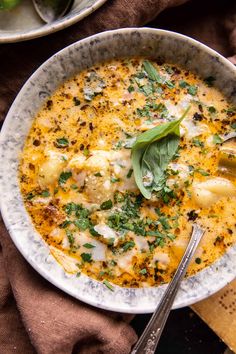 a white bowl filled with food on top of a table