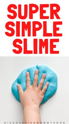 a hand holding a blue doughnut with the words super simple slime on it