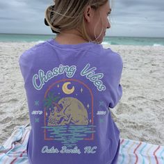 Introducing our Chasing Vibes North Carolina oversized summer crewneck! 🌊 Embrace those summer vibes in style with this trendy piece of clothing for women. 🌞 Perfect for those laid-back days by the shore, this vintage-inspired beach t-shirt exudes a coconut girl aesthetic. 🥥 Its oversized fit makes it ideal as a cover-up or as a standalone statement piece.🏖️Pre-shrunk for the perfect fit. We promise you will love it! If you would like an oversized look like the pictures shown, please refer t Trendy Surfing T-shirt For Summer, Cheap Oversized T-shirt For Beach, Oversized Screen Print T-shirt For Beach Season, Oversized Beachy T-shirt For Vacation, Beachy Oversized Graphic Print T-shirt, Coastal Carolina, Back Day, Retro Graphic Tees, Beach T Shirts