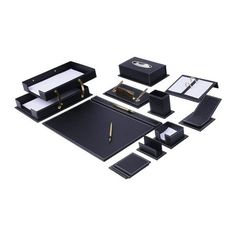 an assortment of black and white items including pen, notebook, ring box, watch