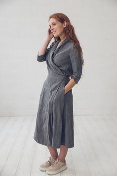 "DETAILS * Long linen wrap dress * With two side pockets and 3/4 length sleeves * Shawl collar dress with belt * Elegant, feminine and stylish choice for work or other occasion * Made from soft wash medium weight (185 g) 100 % European linen fabric * Height of the model is 165 cm (5′ 5″) and she is wearing dress in size S and solid gray color * Please choose desired color and size on the right * Product number: D07 CARE LABEL * machine wash gentle (40 C/104 F) * dry gentle on low heat * wrinkles Elegant Dress With 3/4 Sleeves And Pockets, Elegant Dresses With Pockets And 3/4 Sleeves, Elegant Dress With Pockets And 3/4 Sleeves, Elegant 3/4 Sleeve Dress With Pockets, Elegant Half Sleeve Dress With Pockets, Chic 3/4 Sleeve Dress With Pockets, Chic Dress With 3/4 Sleeves And Pockets, Belted Half Sleeve Midi Dress For Work, Fitted Dress With Pockets And 3/4 Sleeves