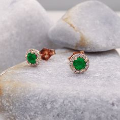 "Get ready to sparkle with Halo Emerald Earrings Studs. These 14k gold earrings are perfect for women. You can wear them on your anniversary or any day you like. The emerald, May's birthstone, is genuine and natural. It's surrounded by tiny diamonds that make it shine even brighter. These dainty stud earrings are a lovely addition to your jewelry collection. They're a perfect gift to celebrate special moments. Measurements: * Gem Stones: 100% Natural Emerald * Center Stone Measurements: 3.5m\"m - (APPROX - 0.15ct) *EACH* * Color and Clarity: Green * Side Stones: 100% Natural Diamonds * Side Stones Measurements: 26 Diamonds, 0.14ct *Both* * Earring Width: 6.50 m\"m * Material: High Quality Solid White Gold 14k/18k ------CUSTOMIZATION------ ♥ Feel free to contact me for any other customizati Emerald Diamond Earrings, Diamond Earrings For Women, White Gold Hoops, Emerald Earrings Studs, Dainty Studs, Tiny Diamond, Earrings Studs, Emerald Earrings, Gem Stones